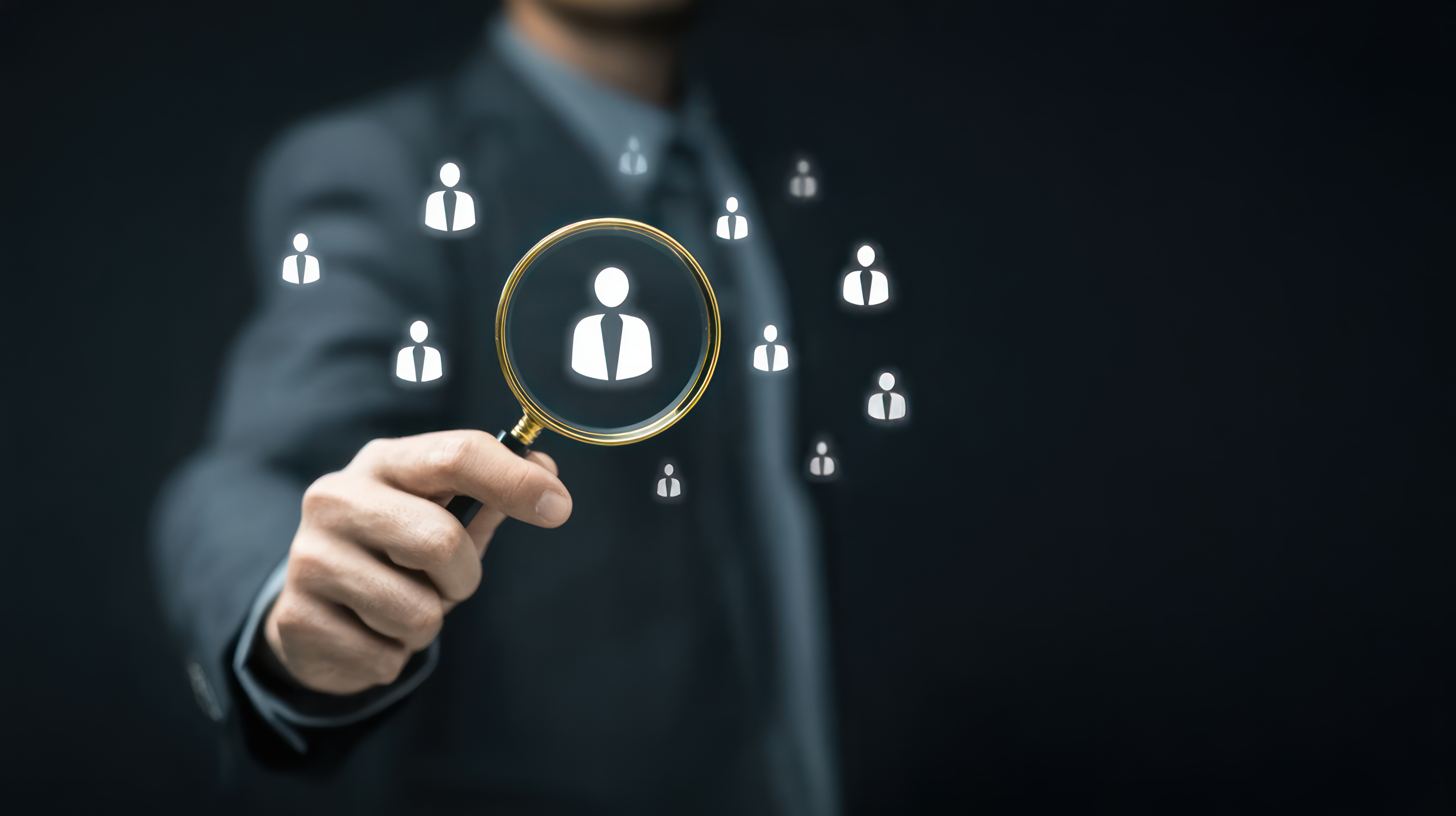 Businessman holding magnifying glass virtual screen with human icon searching employee payroll management system hr payroll digital hiring